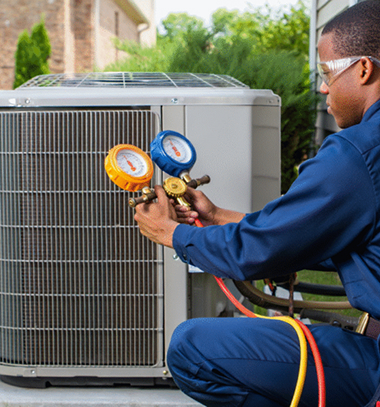 HVAC tech doing maintenance